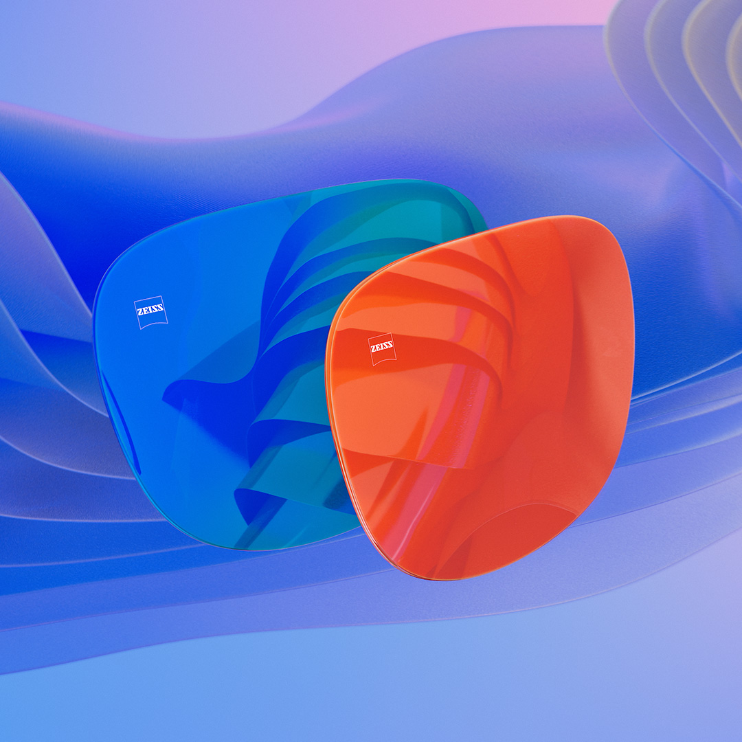 블루 및 오렌지 미러 코팅이 적용된 두 개의 선글라스 렌즈를 보여주는 3D 컴퓨터 일러스트레이션입니다.