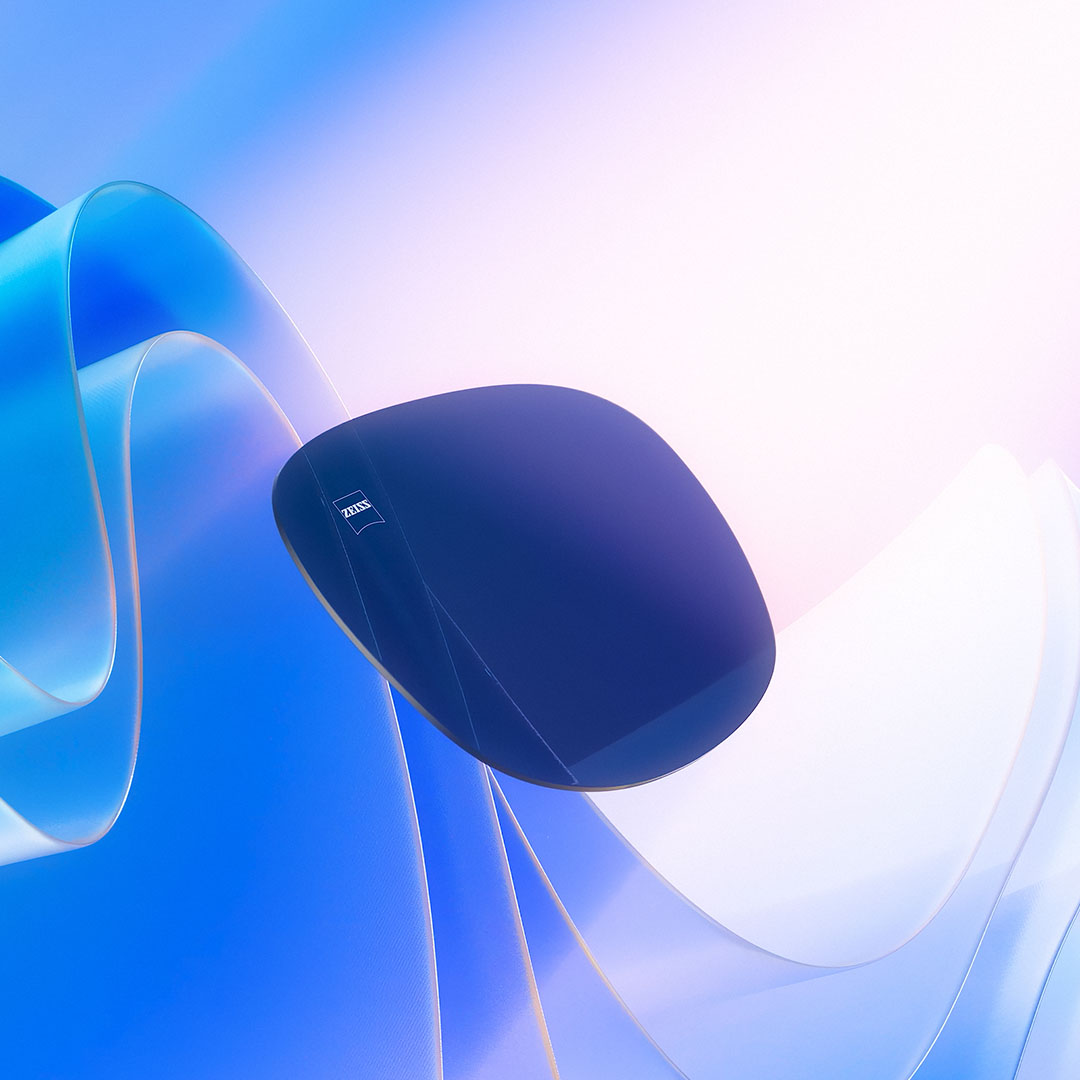 착색 렌즈가 햇빛을 향해 떠가는 모습을 보여주면서, 착색 렌즈의 자외선 차단 능력을 설명하는 컴퓨터 그래픽 일러스트레이션 이미지